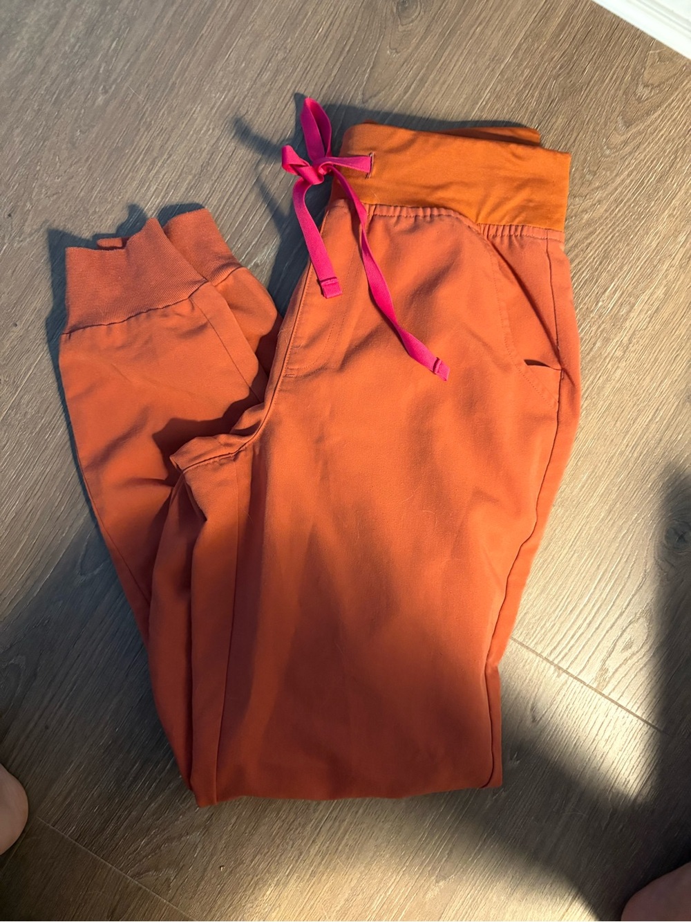 FIGS Orange Cropped Drawstring Joggers with Pink Tie